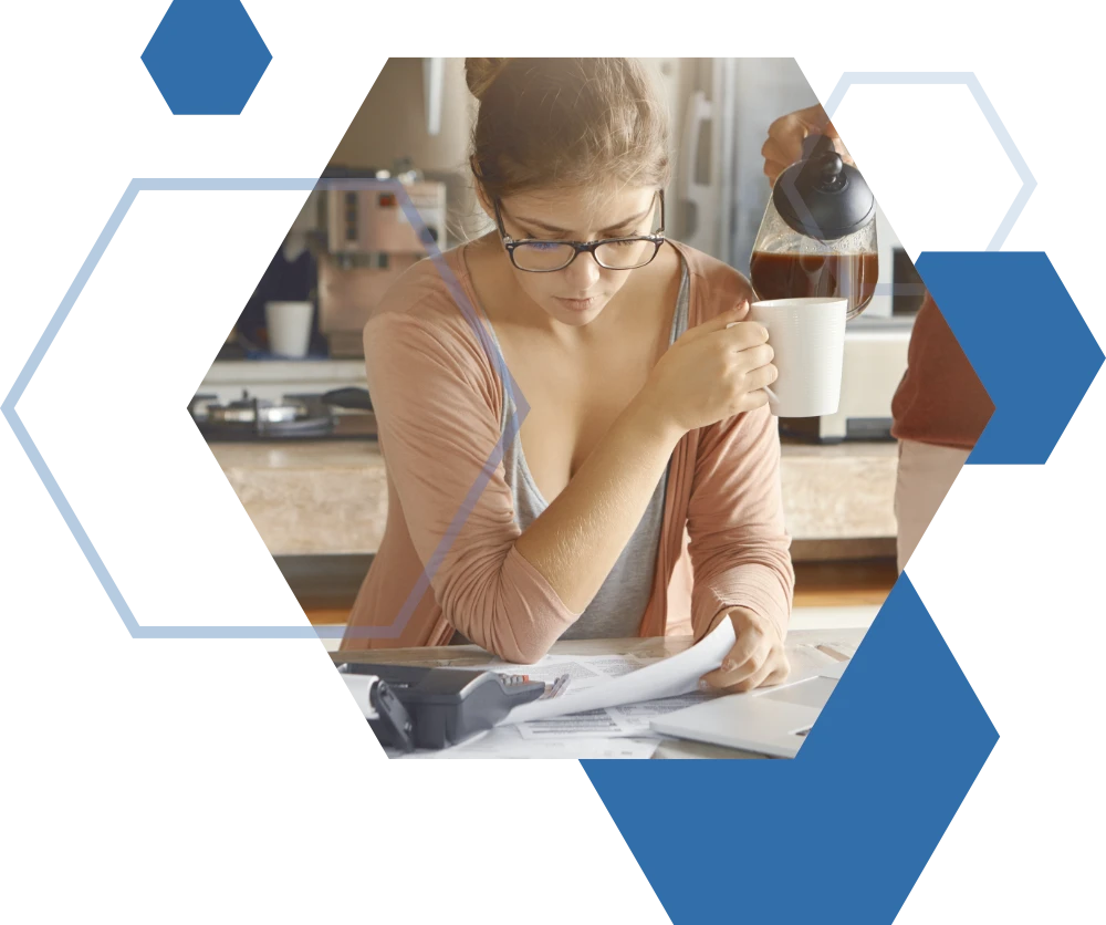 Lady examining tax papers, receiving personalised tax consulting services from J Strydom & Partners to optimise her finances.